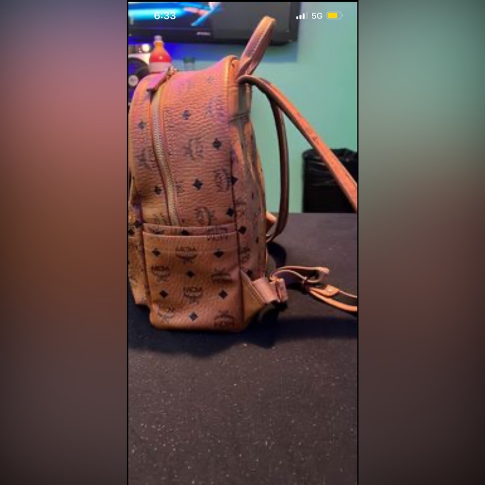 This is a woman’s small MCM bag good condition no where in tear